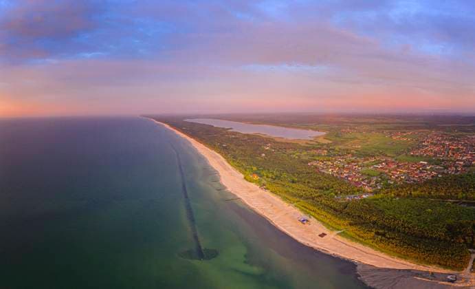Poland, Pomerania, Leba, Aerial view of coastline at Slowinski National Park at sunset HAMF00609