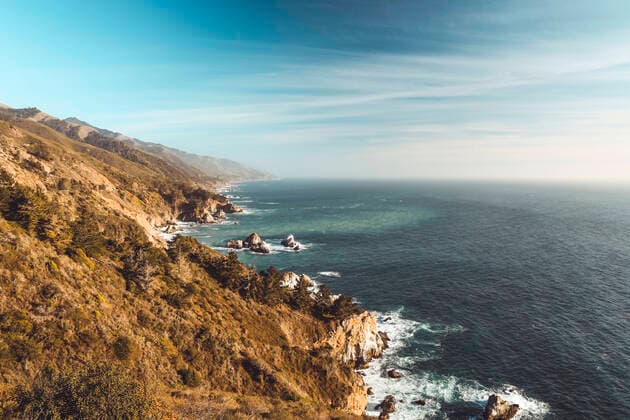 Mountain ridges dropping to ocean near Cabrillo Highway California Big Sur, CA, United States CR_MAKO200611A-393904-01