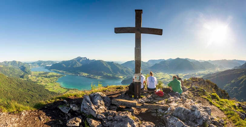 lake Wolfgangsee, town St. Wolfgang im Salzkammergut, mountain Schafberg, summit cross on mountain Sparber, hiker Strobl Salzburg Austria Salzkammergut
