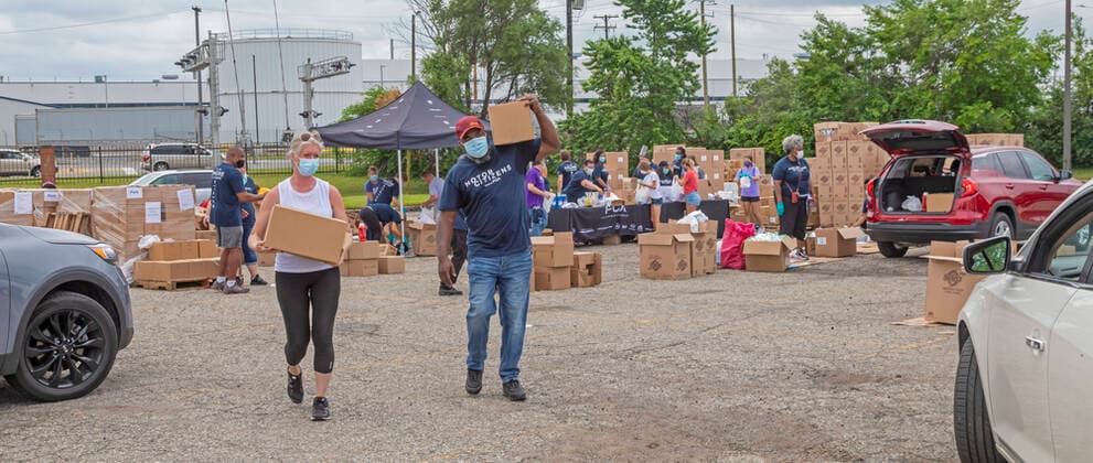 June 27, 2020, Detroit, Michigan, USA: Detroit, Michigan USA - 27 June 2020 - Hundreds waited in line for hours as volunteers from Fiat Chrysler Automobiles distributed food, masks, sanitizer, and other necessities during the coronavirus pandemic.. FCA is building a new assembly plant in the east side neighborhood. Detroit USA - ZUMAw66_ 20200627_zaf_w66_012 Copyright: xJimxWestx