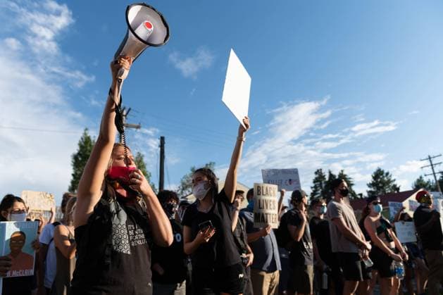 July 3, 2020, Aurora, Colorado, USA: A woman leads a chant during a protest in Aurora Colorado. Aurora USA - ZUMAt221 20200703_zap_t221_004 Copyright: xTylerxTomasellox