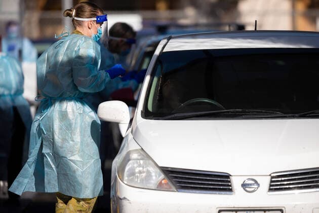 MELBOURNE, AUSTRALIA - JULY 01: ADF personnel are seen conducting tests at the Fawkner Mobile Testing Site as 36 Melbourne suburbs go back into strict lockdown in Victoria during COVID 19 on 1 July, 2020 in Melbourne, Australia. Victoria is suffering from a sustained increase in new infections amid a record testing blitz of 20,000 tests per day in Melbourne?s hotspots. Victoria has recorded 73 new coronavirus cases overnight which brings the total active cases up to 370 since Thursday 25 June. The State Premier, Daniel Andrews announced on Tuesday 30 June that 36 Melbourne suburbs will again be forced into 3rd stage lockdowns at midnight 1st July where residents will only be allowed to leave their house for four reasons