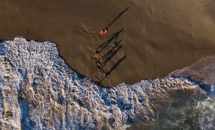 July 5, 2020, San Diego, California, USA: Beach goers play in the waves at Windansea Beach in La Jolla. San Diego kept their beaches opened while other Southern California beaches were closed due to the coronavirus pandemic during the Fourth of July weekend. San Diego USA - ZUMAa97_ 20200705_zaf_a97_028 Copyright: xK.C.xAlfredx