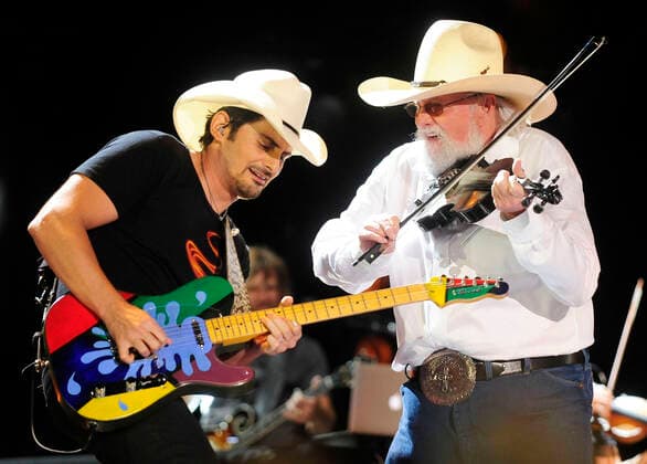 06 July 2020 - Country music and southern rock legend Charlie Daniels has passed away after suffering a stroke. The Grand Ole Opry member and Country Music Hall of Famer was 83. File Photo: 09 June 2013 - Nashville, Tennessee - Brad Paisley, Charlie Daniels. 2013 CMA Music Festival Nightly Concert held at LP Field. Photo Credit: Mike Strasinger AdMedia 257396 2013-06-09 TN Nashville Etats-Unis  Copyright: xAdMediax STAR_257396_038