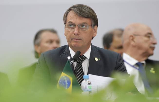 (200707) -- BEIJING, July 7, 2020 (Xinhua) -- File photo taken on Dec. 5, 2019 shows Brazilian President Jair Bolsonaro (Front) attending a conference in Bento Goncalves, Brazil. Brazilian President Jair Bolsonaro announced on July 7, 2020 that he has tested positive for the novel coronavirus. (Xinhua Rahel Patrasso) BRAZIL-PRESIDENT-COVID-19-POSITIVE 