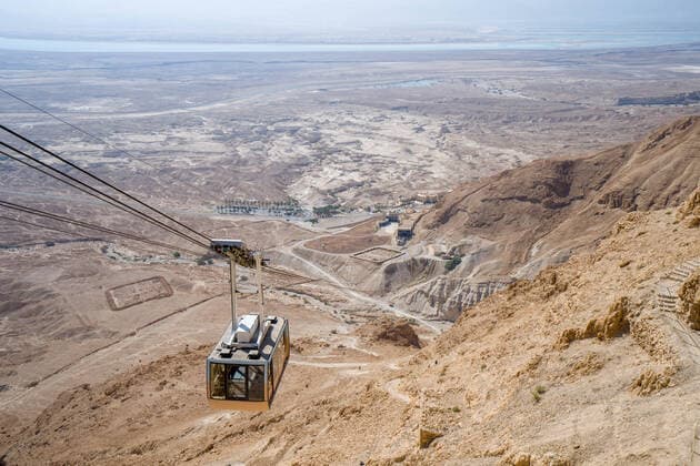 Cable car ride to masada fortress rock plateau in israel on a sunny day Masada, North District, Israel CR_EUSL200703-442625-01
