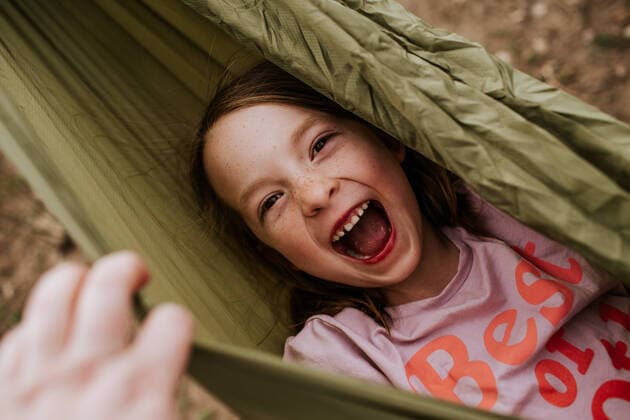 Creative Highlights Symbolfotos Overhead of silly girl laughing in hammock Denver, CO, United States CR_JEMI200707B-441536-01 ,model released, Symbolfoto