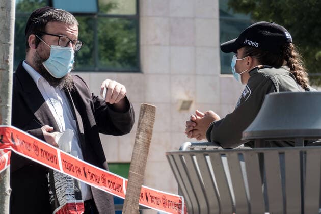 July 12, 2020, Jerusalem, Israel: Police enforce a lockdown on the predominantly Jewish religious neighborhood of Romema in Jerusalem, as well as others in 5 cities nationwide, as the number of new confirmed COVID-19 cases surges. A significant new outbreak of Coronavirus brings on reclosure of segments of the economy. Israel now ranked 7th in the world with 4,100 confirmed cases per million capita. Jerusalem Israel - ZUMAa126 20200712_zap_a126_022 Copyright: xNirxAlonx