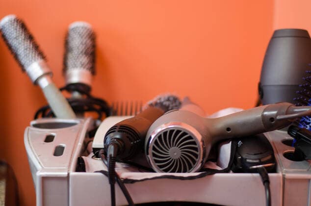 close up of hairdressing accessories in gray shelf close up of various hairdressing accessories in gray shelf  Copyright: xsauletasx 13445012