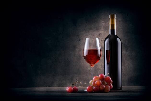  Bottle and glass of red wine with grapes Copyright: xAlexlukinx Panthermedia28281628