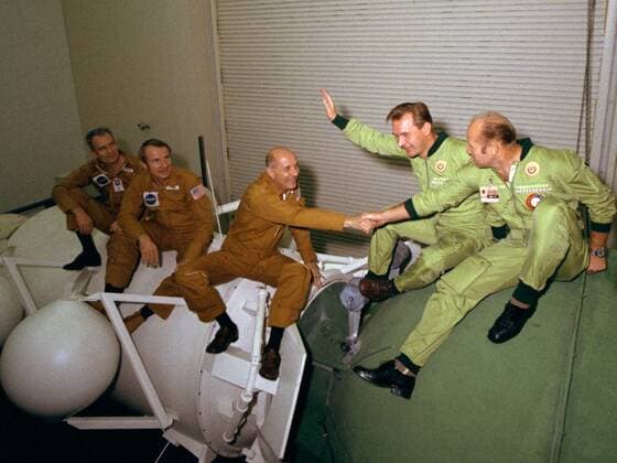 PICTURE SHOWS: The astronauts and cosmonauts sit atop mock-ups at NASA s Johnson Space Center in Houston. At left, the three Americans (left to right, Slayton, Brand and Stafford) are seated on a mock-up of the docking module designed to link the Apollo and Soyuz spacecraft. The two Soviets (Kubasov, left, and Leonov) are atop a mock-up of a Soyuz spacecraft. ... STORY COPY: ANNIVERSARY (17 July 1975): Cold War Rivals Met in Space On July 17, 1975, something momentous happened: two Cold War-rivals met in space. When their respective spacecraft rendezvoused and docked, a new era of cooperative ventures in space began. For more than a decade, American astronauts and Russian cosmonauts have been regularly living and working together in Copyright: xx 40719939 EDITORIAL USE ONLY. NOT FOR USE BY NEWSPAPERS BASED IN THE UK.