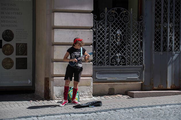 (200718) -- VILNIUS, July 18, 2020 (Xinhua) -- A woman performs during the Street Music Day event in Vilnius, Lithuania, on July 18, 2020. Professional and amateur musicians performed in the streets and parks in the old town of Vilnius to celebrate Street Music Day on Saturday. (Photo by Alfredas Pliadis Xinhua) LITHUANIA-VILNIUS-STREET MUSIC DAY 