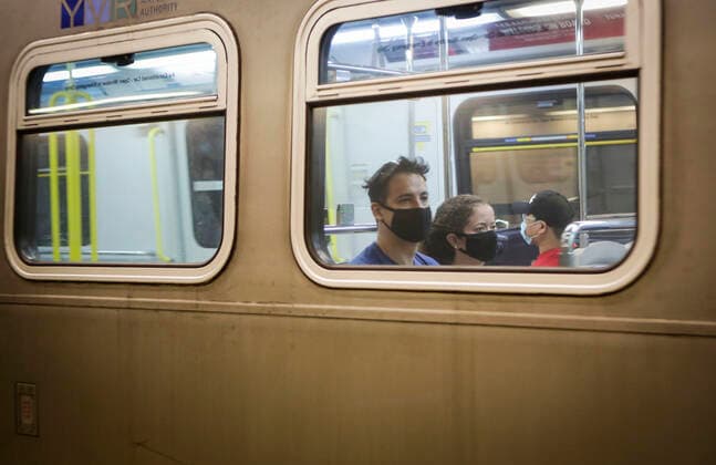 (200718) -- VANCOUVER, July 18, 2020 -- Passengers wearing face masks ride a SkyTrain in Vancouver, British Columbia, Canada, on July 18, 2020. As new COVID-19 cases in British Columbia continued to tick upwards, health officials urged those who can to wear a mask on transit and in other confined spaces, such as grocery stores. (Photo by Xinhua) CANADA-VANCOUVER-COVID-19-FACE MASKS LiangxSen 