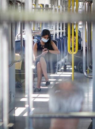 (200718) -- VANCOUVER, July 18, 2020 -- A passenger wearing a face mask rides a SkyTrain in Vancouver, British Columbia, Canada, on July 18, 2020. As new COVID-19 cases in British Columbia continued to tick upwards, health officials urged those who can to wear a mask on transit and in other confined spaces, such as grocery stores. (Photo by Xinhua) CANADA-VANCOUVER-COVID-19-FACE MASKS LiangxSen 