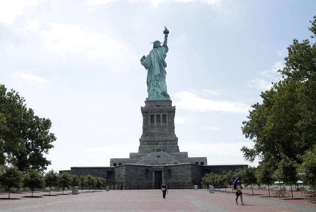 The grounds of Liberty Island and The Statue of Liberty are quiet with only a few sightseers on Monday, July 20, 2020 in New York City. The Statue of Liberty reopened Monday with reduced capacity to help maintain social distancing due to the Coronavirus. Today New York City entered Phase 4 of its reopening.  NYP20200720108 JOHNxANGELILLO