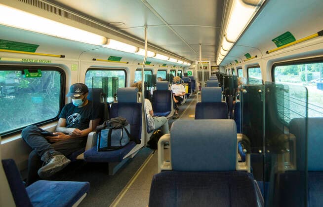(200721) -- TORONTO, July 21, 2020 -- Passengers wearing face masks ride a Go train in Toronto, Canada, on July 21, 2020. Starting Tuesday, Go Transit customers are required to wear masks or face coverings. (Photo by Xinhua) CANADA-TORONTO-COVID-19-MEASURES-GO TRANSIT ZouxZheng 