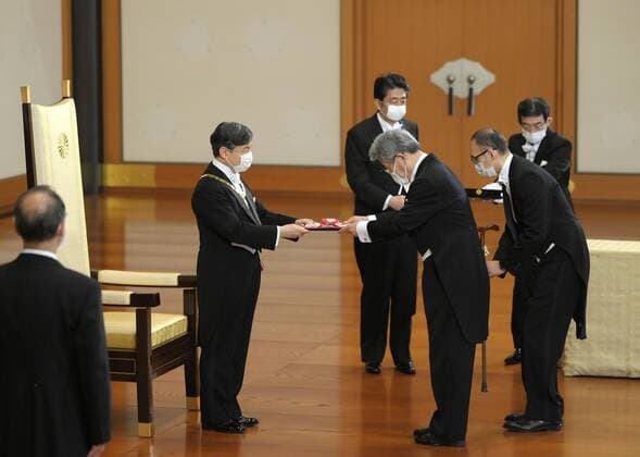Imperial conferment of decorations Japanese Emperor Naruhito (2nd from L) confers the Grand Cordon of the Order of the Rising Sun to former Shikoku Electric Power Co. President Momoki Tokiwa at the Imperial Palace in Tokyo on July 31, 2020. (Pool photo) 