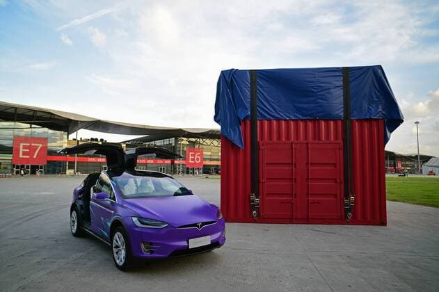 SHANGHAI, CHINA - JULY 30: A Tesla Model X electric vehicle sits parked next to an airdrop box installation advertising Tencent s mobile game Game For Peace one day before the 2020 China Digital Entertainment Expo & Conference (ChinaJoy) at Shanghai New International Expo Center on July 30, 2020 in Shanghai, China.  Copyright: xVCGx CFP111293387462