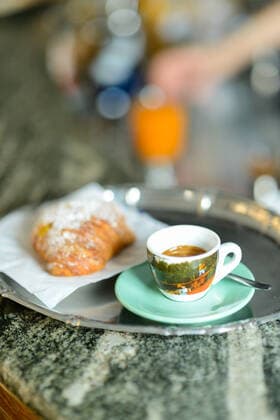 Espresso coffee and custard pastry cream croissant for a caloric Rome, Lazio, Italy CR_EHKZSR200715-450545-01