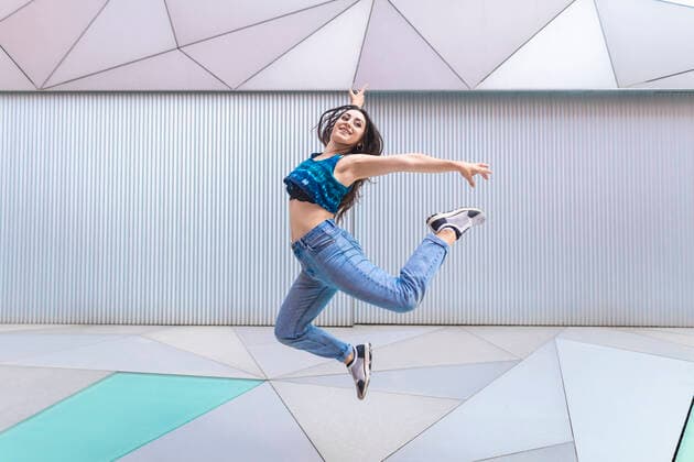 Creative Highlights Symbolfotos Woman performing a flight in the choreography in the street Spain, Community of Madrid, Madrid CR_VWJTCV200731-463216-01 ,model released, Symbolfoto