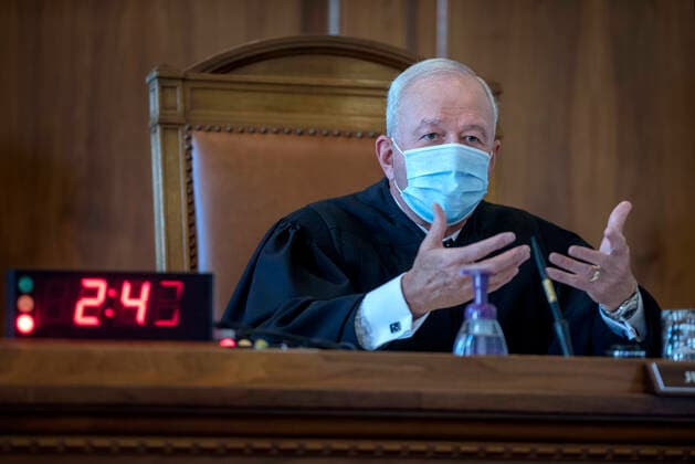August 4, 2020, USA: Chief Justice of the New Mexico Supreme Court Michael Vigil questions the attorney representing a group that feels the Governor has exceeded her authority in closing businesses across the state due the COVID-19 health emergency. The Supreme Court agreed with the Governor during the healing in Santa Fe Tuesday August 4, 2020. USA - ZUMAab1_ 20200804_zaf_ab1_012 Copyright: xEddiexMoorex