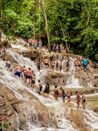 People climbing Dunn s River Falls, Ocho Rios, Saint Ann Parish, Jamaica, West Indies, Caribbean, Central America Copyright: KarolxKozlowski 1245-2018 Editorial Use Only