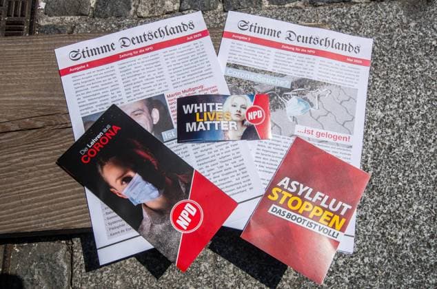 August 8, 2020, Munich, Bavaria, Germany: Examples of the materials the group had available, including Stimme Deutschlands and other materials designed to capitalize on the Coronavirus crisis, racism, discontent with non-whites in Germany, and with Black Lives Matter, the neonazi NPD party of Munich held a Ã¢â‚¬oeAlso White Lives MatterÃ¢â‚¬Â sic rally at MunichÃ¢â‚¬â ¢s Stachus. Ten attended, which included Franz H., Pia V., Manfred Schiessl, a BIA member who also is an Ordner at the Coronademos, and several others including neonazi Josef. H., who, among two other participants, was engaged in long conversations with the controversial Munich Police Kommunikationsteam who are often seen at demos as being openly close to the far-right spe - ZUMAb160 20200808_zbp_b160_054 Copyright: xSachellexBabbarx