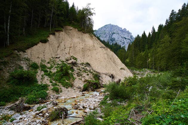 Reutte, Austria, 25th July 2020, Slipped mountainside, mudslides along the river on the trail up to mountain hut Fuessener Huette.