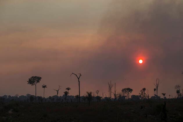 August 13, 2020, Novo Progresso, Paro, BRAZIL: Sunset highlights curtain of smoke from a fire in an area of the Amazon jungle in the region of Alvorada da Amazonia, in Novo Progresso, state of Para, on the afternoon of this Thursday, on 13th August. In July, the federal government issued a decree banning burning throughout Brazil for 120 days. The veto comes amid pressure from domestic and international investors due to the country s negative image abroad caused by environmental management and increased deforestation. Novo Progresso BRAZIL - ZUMAs255 20200813_zip_s255_003 Copyright: xFernandoxSouzax