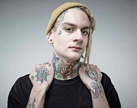 Portrait of young man with tattoos, close up model released Symbolfoto RH000257