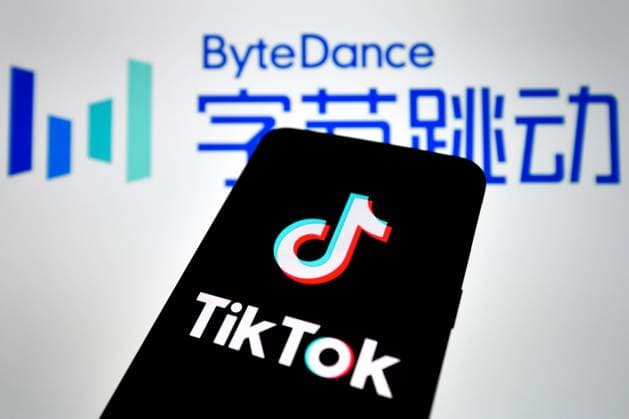 August 23, 2020, Haikou, Hainan, China: In this photo illustration, a TikTok logo seen displayed on a smartphone with a ByteDance logo picture in the background..ByteDance, parent company of popular video-sharing app TikTok on Sunday confirmed it would be filing a lawsuit on Monday local time against the Trump administration over the executive order signed by President Donald Trump banning its service in the United States. Haikou China - ZUMAs197 20200823_zaa_s197_003 Copyright: xSheldon Cooperx