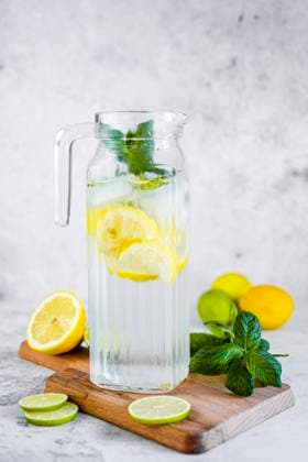 Detox water with lemon, lime and mint and ice cubes GIOF08702