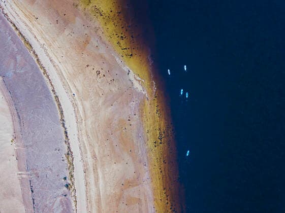 Aerial view of people surfing by sandy bank of Teriberka River model released Symbolfoto KNTF04963