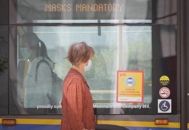 (200824) -- VANCOUVER, Aug. 24, 2020 -- A woman wearing a face mask prepares to get on a bus in Vancouver, British Columbia, Canada, on Aug. 24, 2020. Anyone on board a TransLink or British Columbia (BC) Transit bus, boat or train and passengers on board BC Ferries vessels are required to wear a face mask beginning Monday to help stop the spread of COVID-19. (Photo by Xinhua) CANADA-BRITISH COLUMBIA-VANCOUVER-PUBLIC TRANSIT-FACE MASK-MANDATORY LiangxSen 