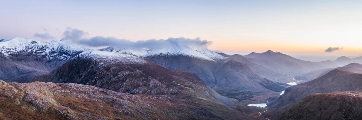 Panoramic view of the MacGillycuddy s Reeks in snow and the Black Valley at dawn in winter, stitched composite; County Kerry, Ireland  Copyright: MichealxHoward 13492102