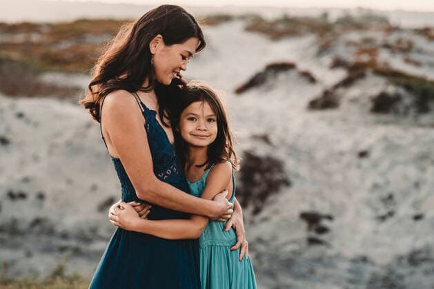 Beautiful 45 yr old mom embracing young daughter at the beach San Diego, CA, United States CR_KESM200828-237846-01 ,model released, Symbolfoto