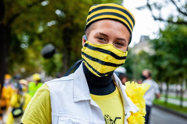 September 1, 2020, The Hague, South Holland, Netherlands: An XR model is seen wearing a bees hat and face mask during the fashion show..An XR fashion show was carried out in front of the House of Representatives in The Hague. Models wore yellow, black, and white colourful second-hand outfits to symbolise the collectivity of bees, to show that thinking and working together can help us out of this crisis. The Hague Netherlands - ZUMAs197 20200901_zaa_s197_025 Copyright: xAnaxFernandezx