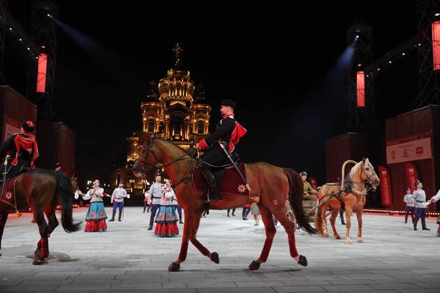 MOSCOW REGION, RUSSIA - SEPTEMBER 6, 2020: A performance by the Kremlin Equestrian School and the Moscow Cossack Choir during a concert by participants in the Spasskaya Tower International Military Music Festival by the Main Cathedral of the Russian Armed Forces. Mikhail Japaridze TASS  TS0E6158