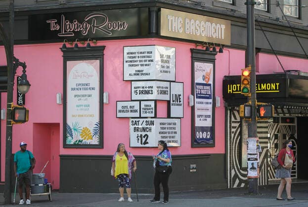 (200910) -- VANCOUVER, Sept. 10, 2020 -- People stand outside of a nightclub on Granville street in Vancouver, British Columbia, Canada, Sep 9, 2020. As more evidence found nightclubs and bars are the sources led to the rebound of COVID-19 cases in Vancouver, health authority ordered to close all nightclubs and banquet halls immediately. (Photo by Xinhua) CANADA-VANCOUVER-COVID-19-MEASURE LiangxSen 