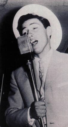 1956: SILVIO BERLUSCONI as a young man at a school ball. From the Salesians he meets the one who will be his lifelong friend: Fedele Confalonieri. The two share the summers aboard the cruise ships Costa and Grandi Viaggi, with their musical quartet quattro doctores . We used to board in the summer, to bring home some money - Berlusconi himself said -. In the morning I played games on the bridge, in the afternoon I also toured the city I had never visited in my life; in the evening first I sang in the jazz orchestra, then at night, as a soloist voice and guitar . Milan Italy - ZUMAq04_ 20010511_kee_z03_036 Copyright: xBerlusconixFamilyxAlbumx