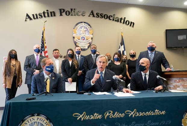 September 10, 2020, Austin, Texas, USA: Texas Governor GREG ABBOTT, c, alongside Republican Attorney General KEN PAXTON, l, and House Speaker DENNIS BONNEN holds a press conference with Austin police and announced a plan to punish Texas cities that cut police spending. Abbott also asked state legislators and candidates for office to sign a pledge backing police with the hashtag TexasBackstheBlue. Austin USA - ZUMAd150 20200910_znp_d150_012 Copyright: xBobxDaemmrichx