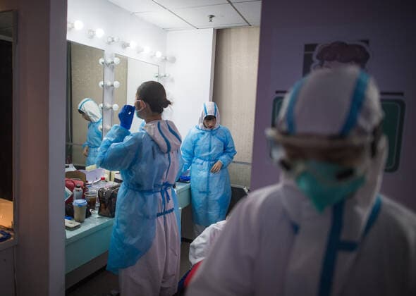 (200912) -- WUHAN, Sept. 12, 2020 -- Actors from the People s Art Theatre of Wuhan change costumes during a drama telling the story of medical staff during the fight against the COVID-19 pandemic in Wuhan, capital of central China s Hubei Province, Sept. 11, 2020. ) CHINA-WUHAN-MEDICAL STAFF THEMED DRAMA (CN) XiaoxYijiu 