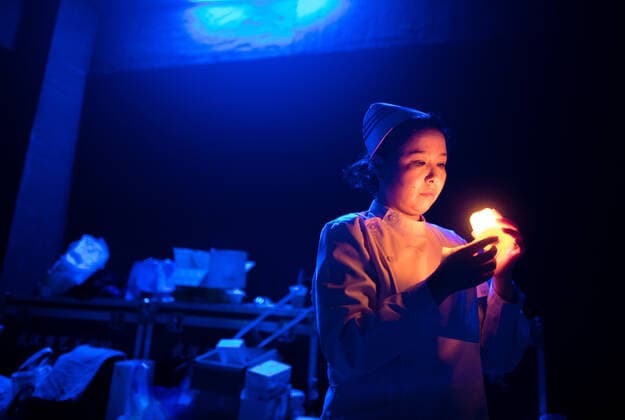 (200912) -- WUHAN, Sept. 12, 2020 -- An actress from the People s Art Theatre of Wuhan checks stage props before a drama telling the story of medical staff during the fight against the COVID-19 pandemic in Wuhan, capital of central China s Hubei Province, Sept. 11, 2020. ) CHINA-WUHAN-MEDICAL STAFF THEMED DRAMA (CN) XiaoxYijiu 