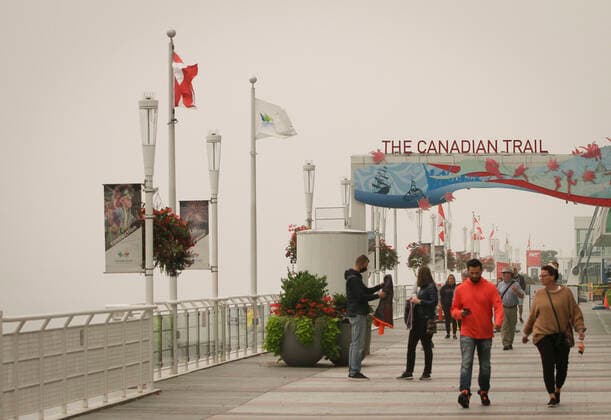 (200913) -- VANCOUVER, Sept. 13, 2020 -- People walk along the harbour in heavy smog in Vancouver, British Columbia, Canada, Sept. 13, 2020. As smoke from U.S. wildfires continues to blow north towards Canada, Vancouver on Sunday was among the top five major cities in the world for bad air quality according to Air Quality Index (AQI). (Photo by Xinhua) CANADA-VANCOUVER- AIR QUALITY-U.S.-WILDFIRE SMOKE LiangxSen 