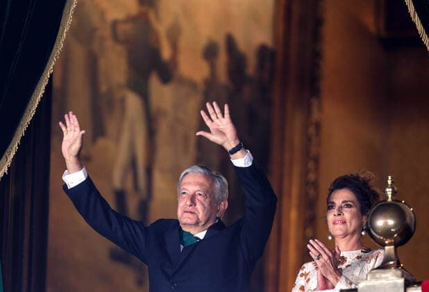 (200916) -- MEXICO CITY, Sept. 16, 2020 -- Mexican President Andres Manuel Lopez Obrador (L) waves to the people on the central balcony of the National Palace during the Independence Day celebrations in Mexico City, capital of Mexico, Sept. 15, 2020. (Photo by Xinhua) MEXICO-MEXICO CITY-INDEPENDENCE DAY-CELEBRATION FranciscoxCanedo 