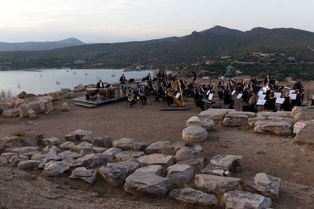 (200917) -- ATHENS, Sept. 17, 2020 -- Musicians perform a musical in front of the ruins of the Temple of Poseidon at cape Sounion, some 70 km southeast of Athens, Greece, on Sept. 17, 2020. On the occasion of the 70th anniversary of the establishment of the Greek National Tourism Organization (GNTO) and the 71st anniversary of the founding of the People s Republic of China and the Mid-Autumn festival, a musical entitled As long as there shall be Achaeans -- Variations on a Sunbeam was staged on Thursday in front of the ruins of the emblematic 2,500-year-old Temple of Poseidon, the god of the sea in Greek mythology. ) GREECE-CAPE SOUNION-MUSICAL-SINO-GREEK FRIENDSHIP MariosxLolos 