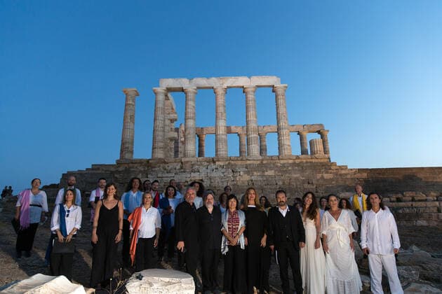 (200917) -- ATHENS, Sept. 17, 2020 -- Chinese Ambassador to Greece Zhang Qiyue (6th R, Front) poses for a group photo with guests and musical performers in front of the ruins of the Temple of Poseidon at cape Sounion, some 70 km southeast of Athens, Greece, on Sept. 17, 2020. On the occasion of the 70th anniversary of the establishment of the Greek National Tourism Organization (GNTO) and the 71st anniversary of the founding of the People s Republic of China and the Mid-Autumn festival, a musical entitled As long as there shall be Achaeans -- Variations on a Sunbeam was staged on Thursday in front of the ruins of the emblematic 2,500-year-old Temple of Poseidon, the god of the sea in Greek mythology. ) GREECE-CAPE SOUNION-MUSICAL-SINO-GR