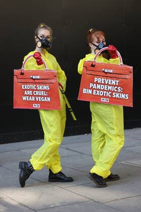 . 17 09 2020. London, United Kingdom. PETA supporters dressed in hazmat suits stage a protest against the use of exotic animal skins at London Fashion Week.  xStephenxLockx xi-Imagesx IIM-21623-0012