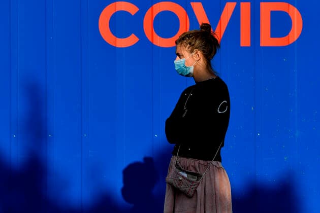 The Czech Republic confirmed 985 COVID-19 cases on Sunday, dropping under 1,000 for first time after a week, but fewer people are usually tested during weekends. People wait at the sampling point for testing on COVID-19 in Prague, Czech Republic, September 21, 2020. (CTKxPhoto VitxSimanek) CTKPhotoP202009210294801 VIS 002
