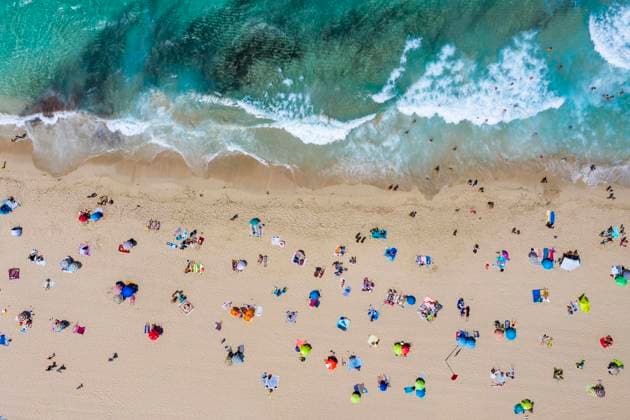 Spain, Mallorca, Cala Mesquida, Aerial view of people relaxing on Cala Agulla beach in summer AMF08433
